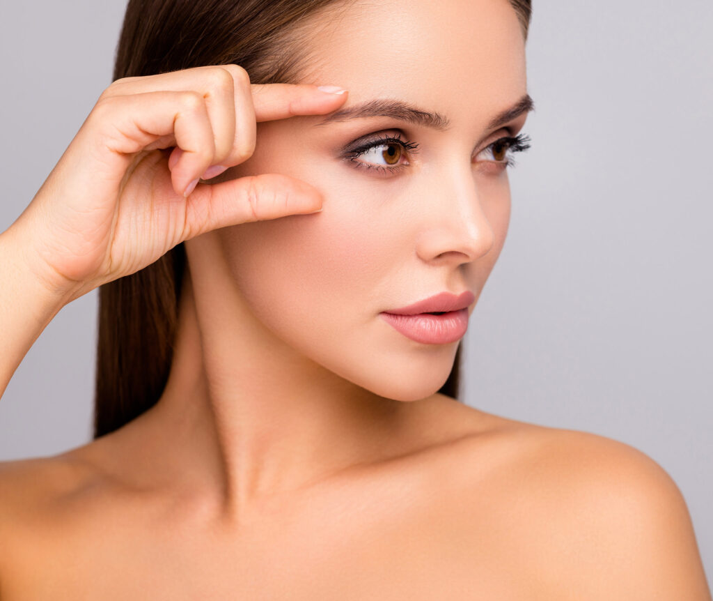 Closeup profile photo of beautiful lady nude naked shoulders plump, shape lips tempting appearance fingers check eyebrow eye line without wrinkles isolated grey color background